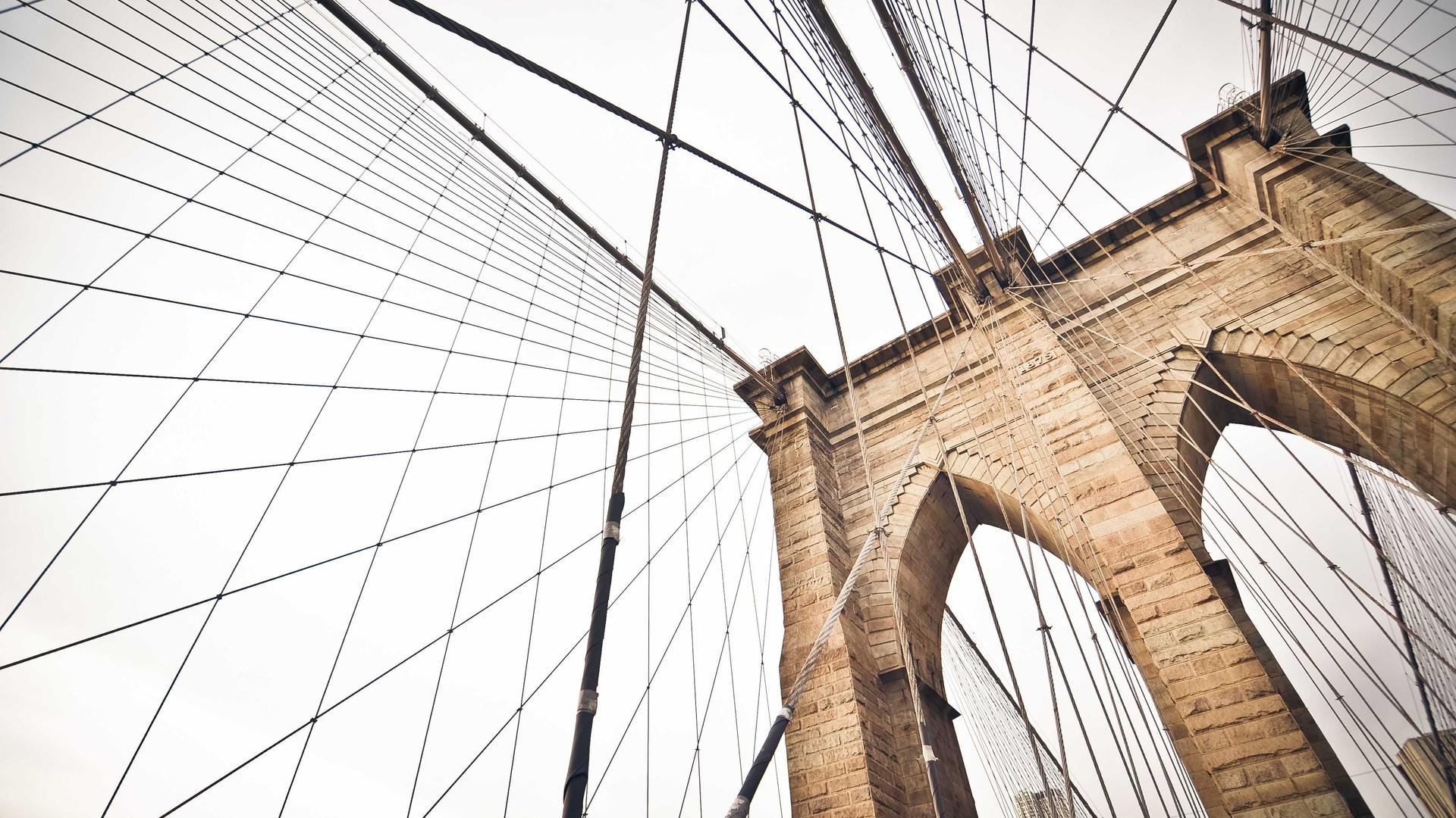 Editorial context photo looking through suspension-bridge cables